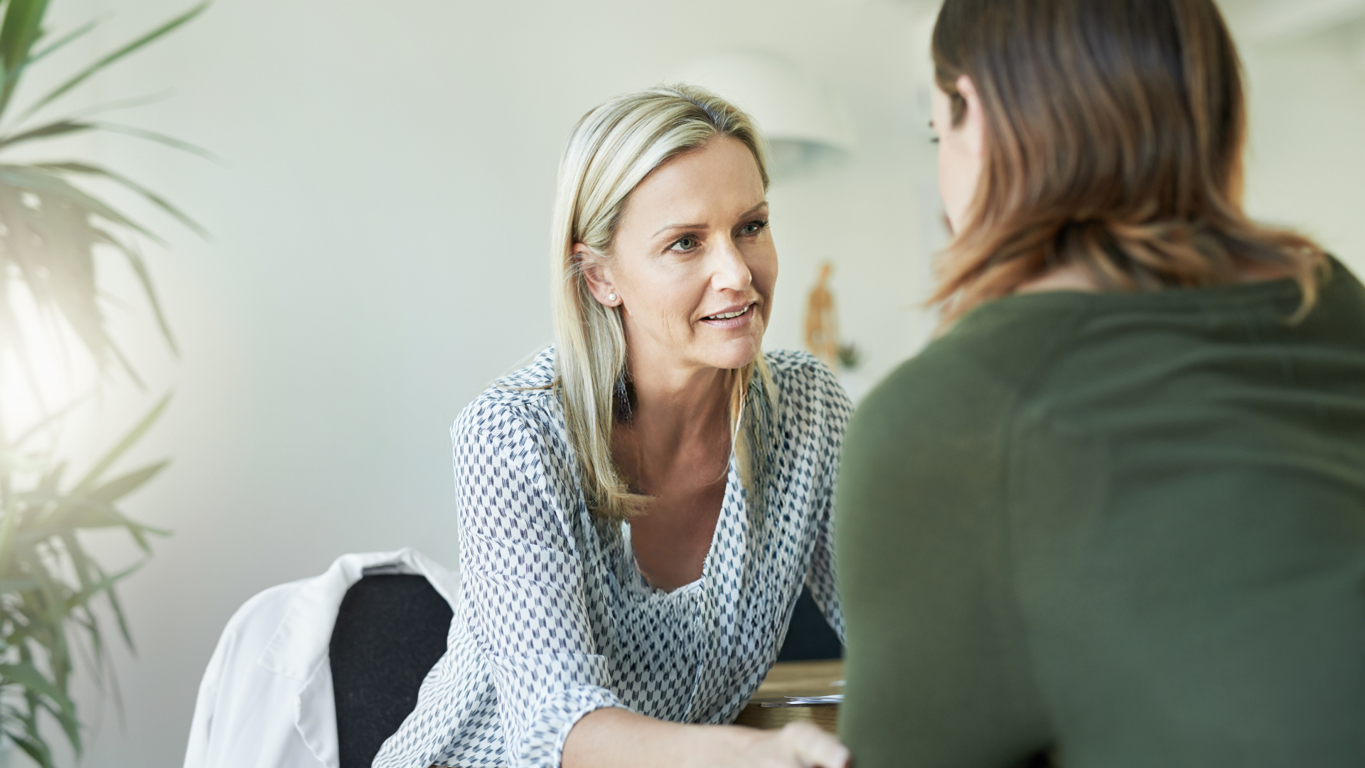 Two females talking showing empathy