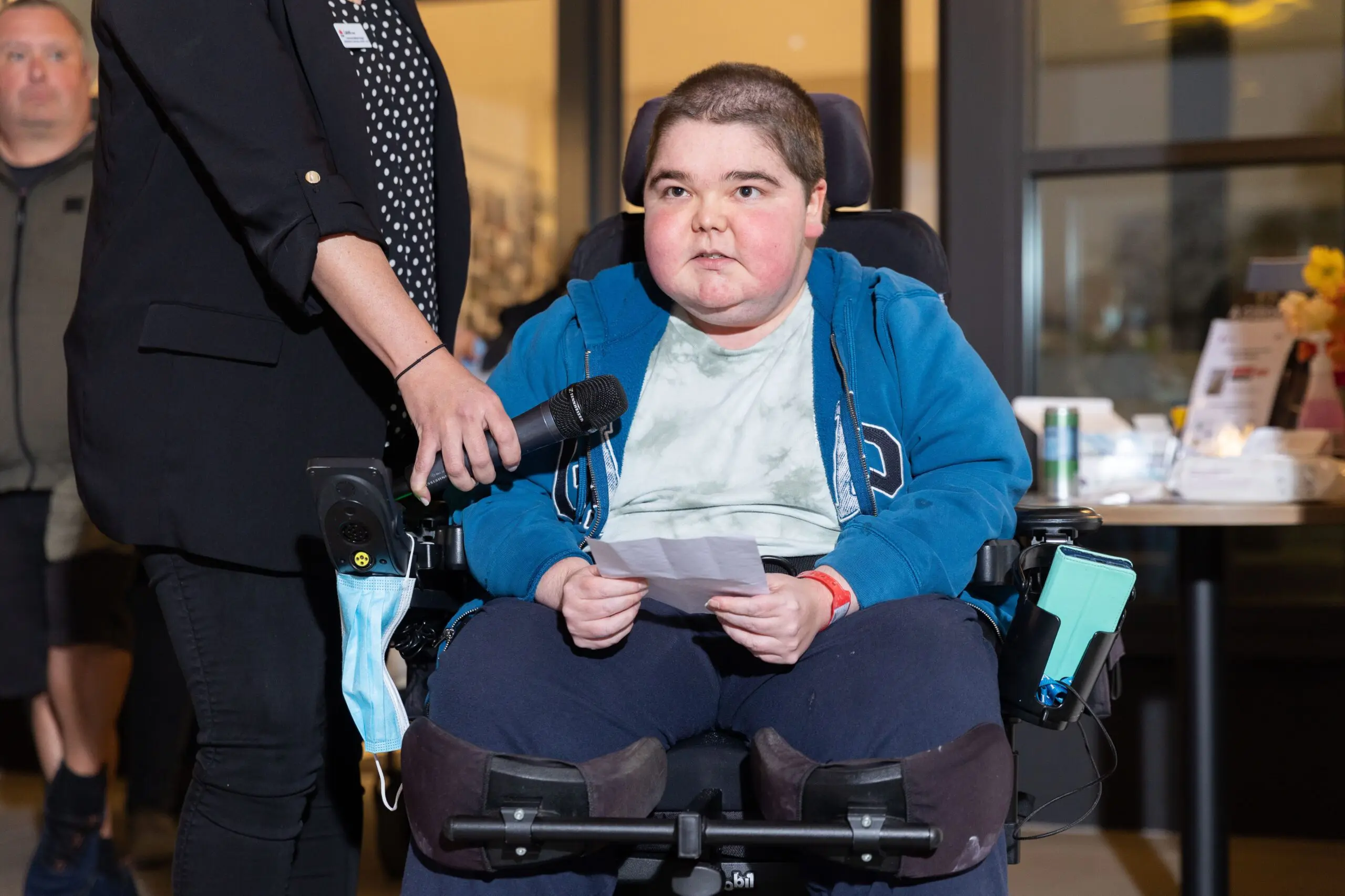 Young man in wheelchair giving a speech