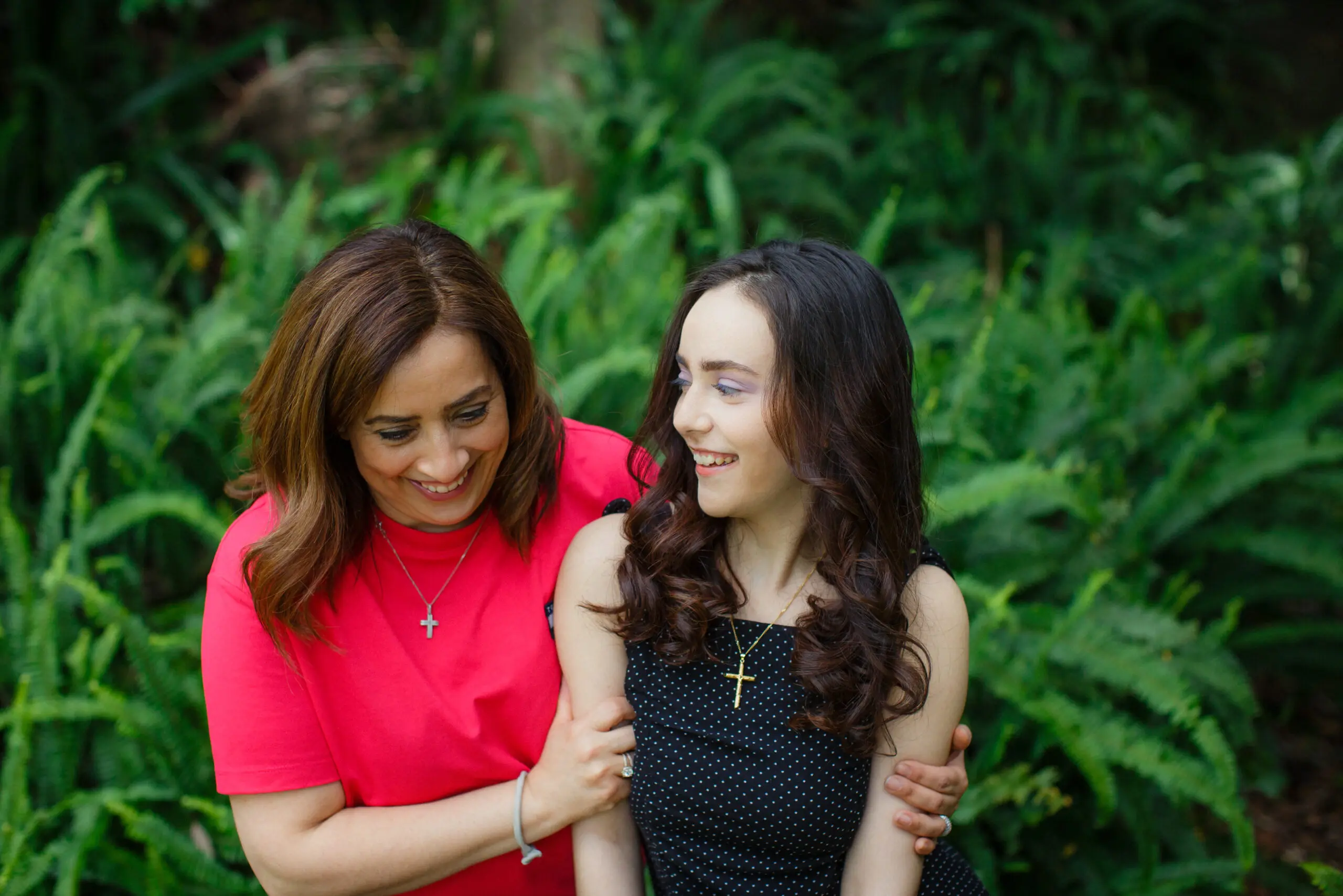 Mum and young daughter laughing