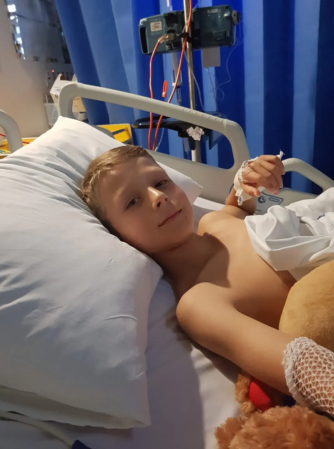 Little boy in hospital bed