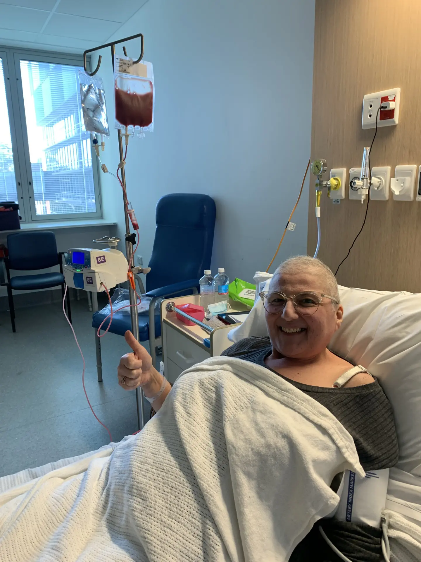 A woman laying in hospital bed