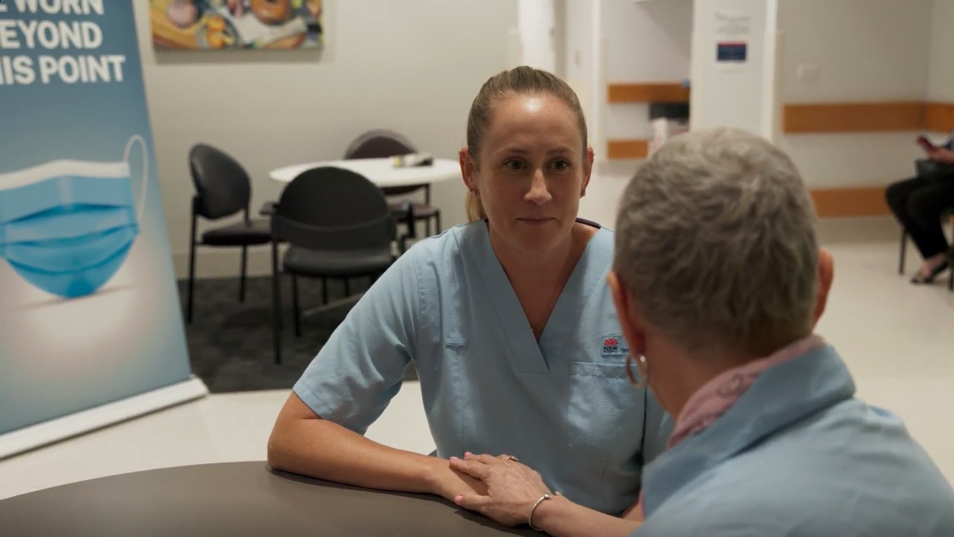 Healthcare staff discussing with patient at the Northern Sydney Cancer Centre