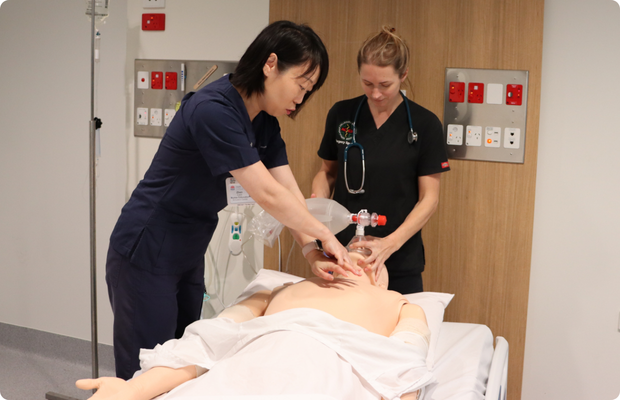 Two healthcare staff simulation training