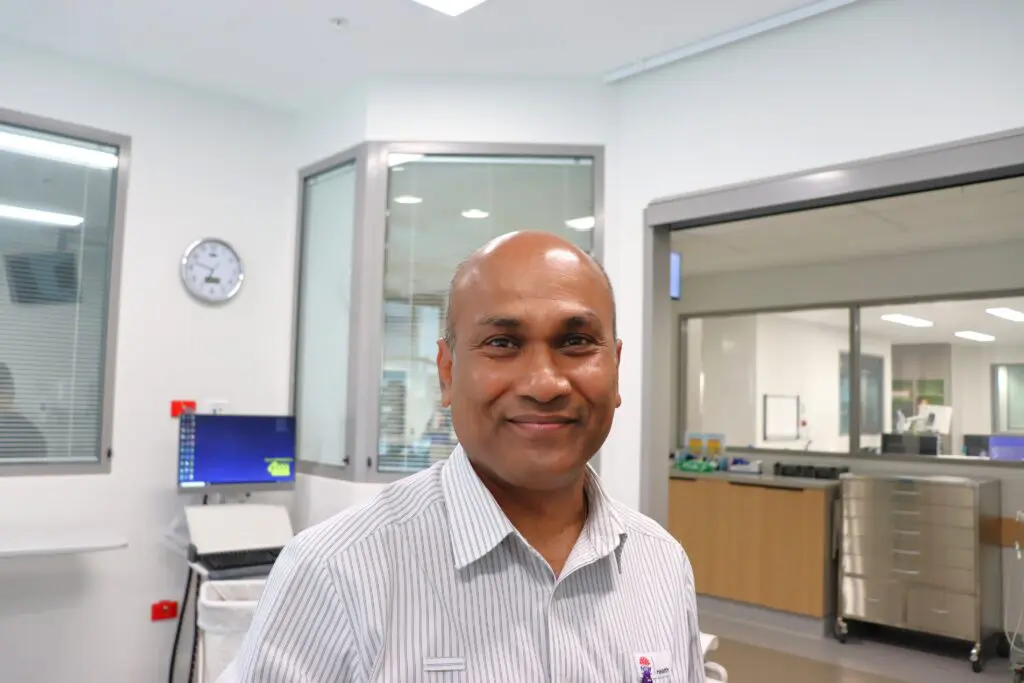 Man smiling working in ICU