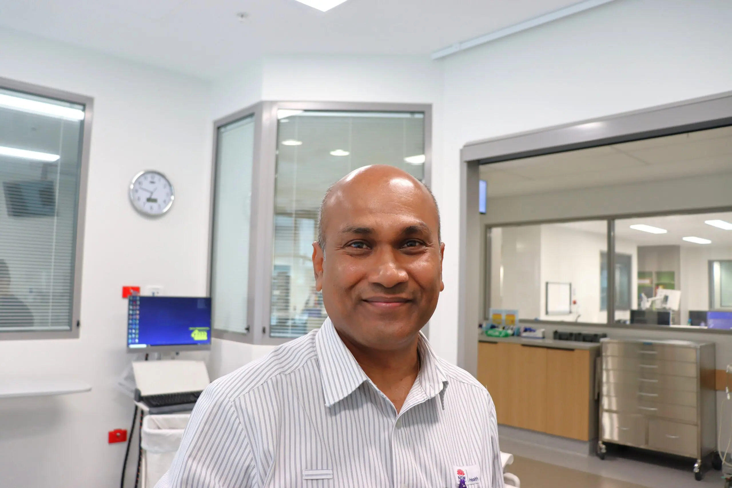 Man smiling working in ICU