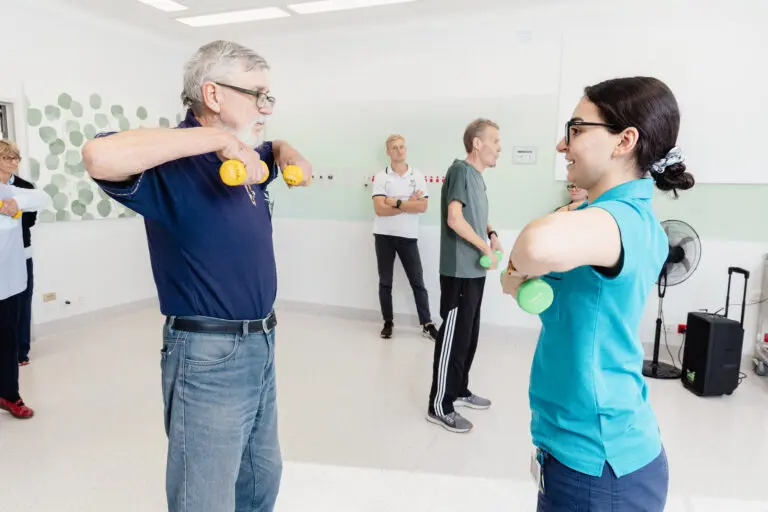 Exercise physiologist with patient