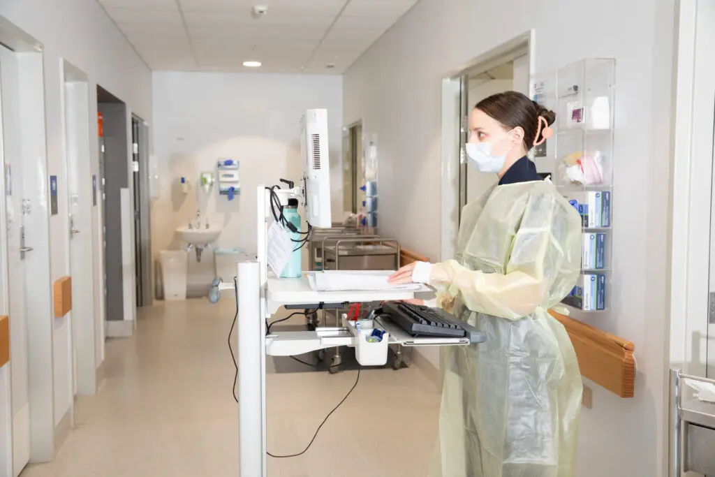 Female nurse looking at her monitor
