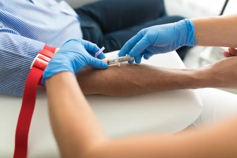 Senior man having a blood test done by a nurse