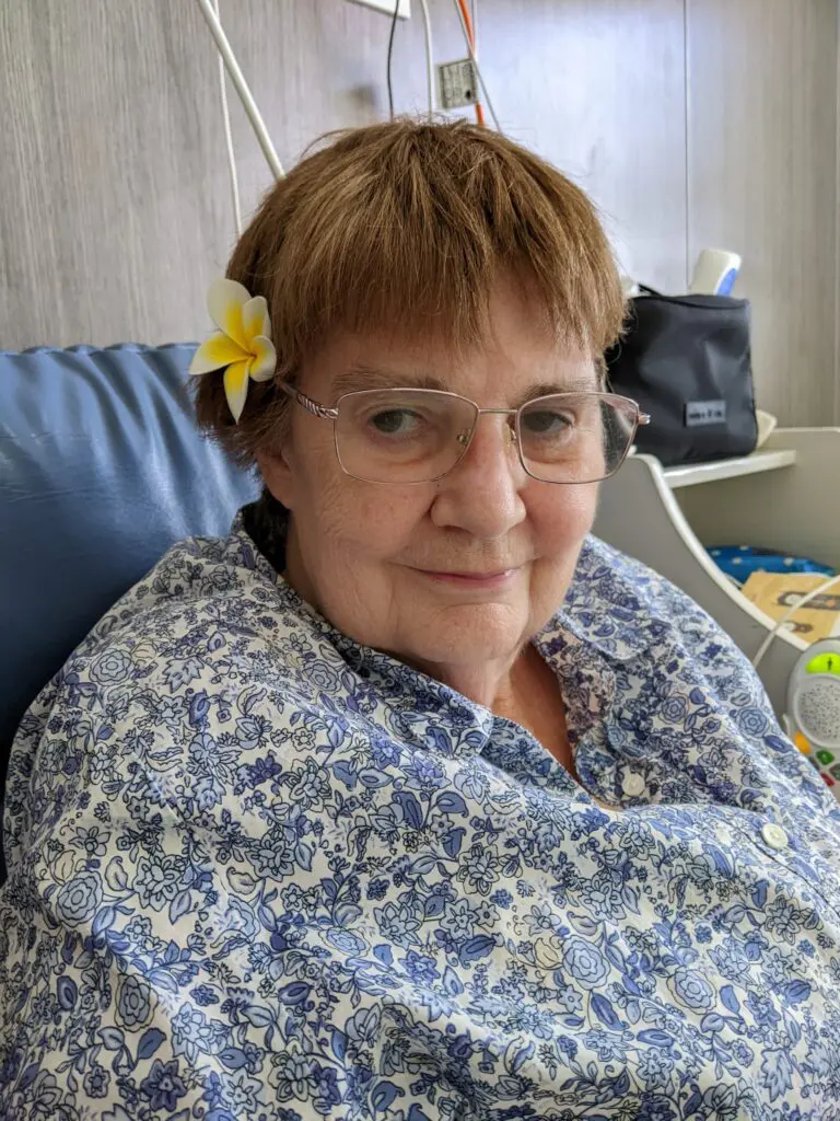 Woman with a flower behind her ear