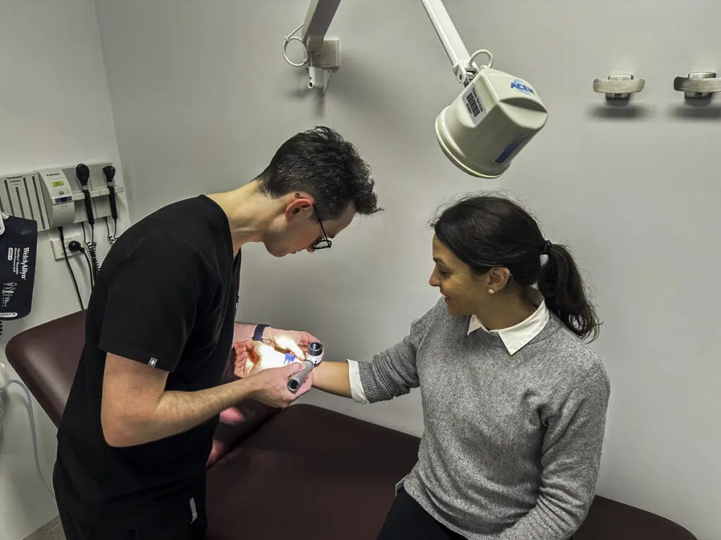 Clinician treating patient