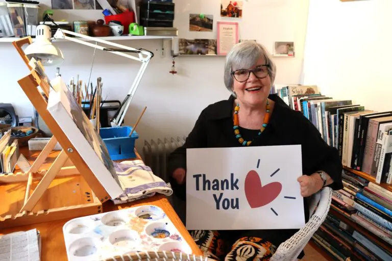 Sepsis patient holding a thank you sign