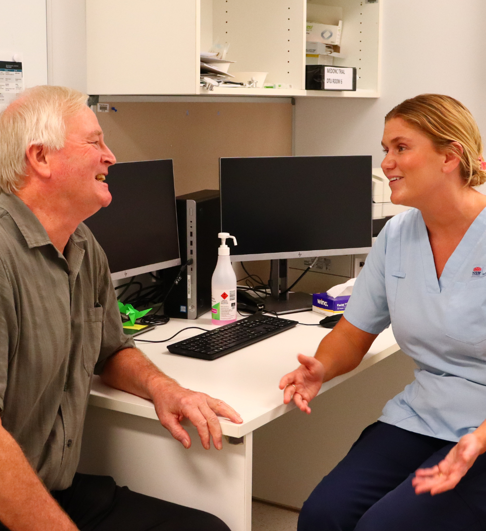 John discussing his treatment with Registered Nurse Emily at NSCC