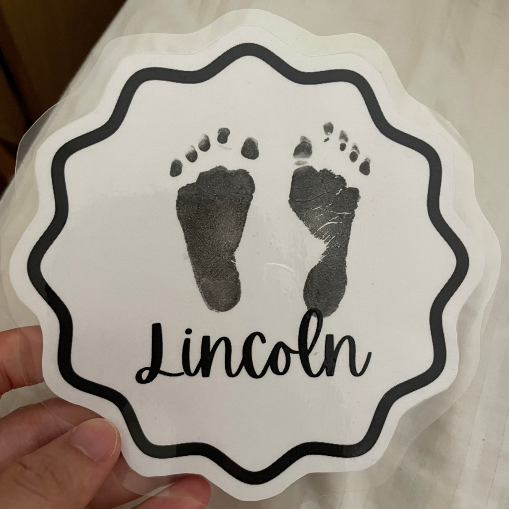 Lincoln's footprints at 1 week old.