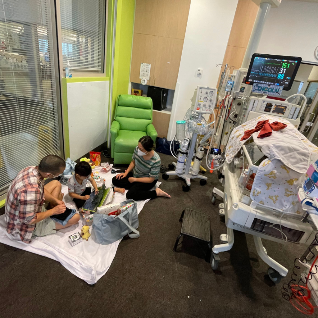 Lincoln's family unwrapping Christmas gifts at NICU