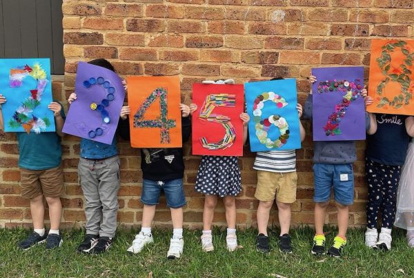 Pre school children holding numbers