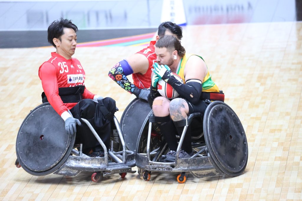 3 male players in wheelchair