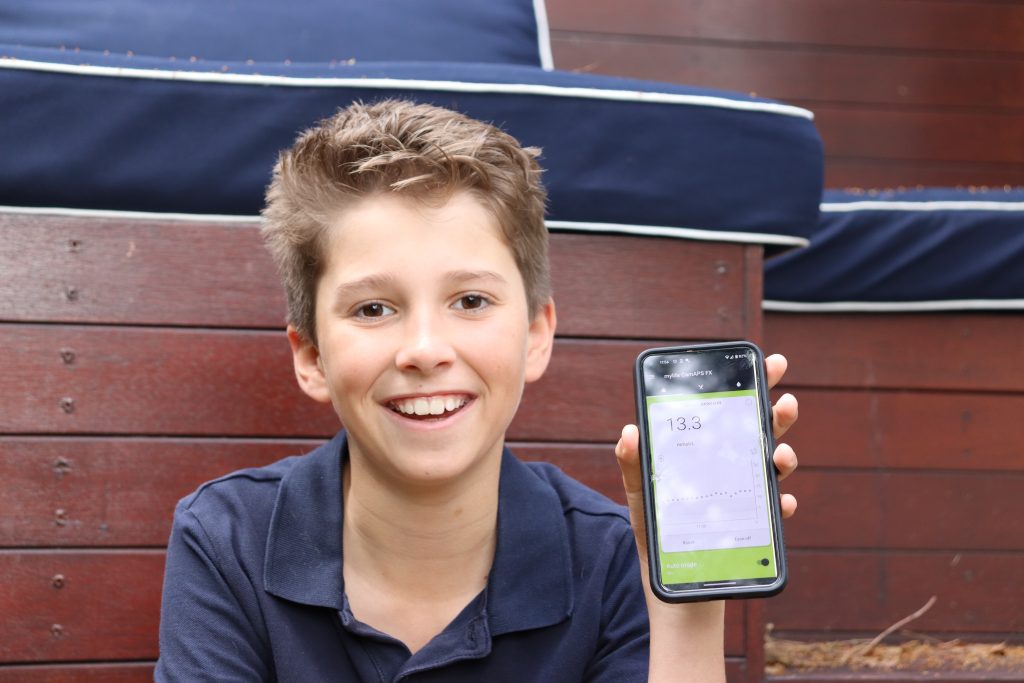 Thomas with the CGM app, advanced diabetes technology