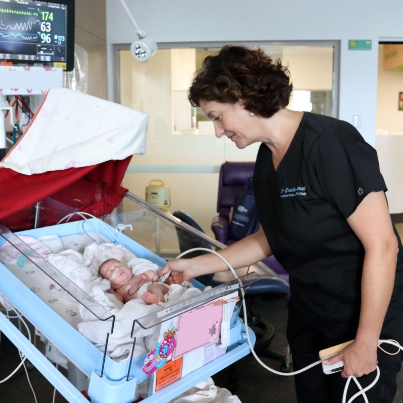 Dr Eveline Staub with baby in NICU