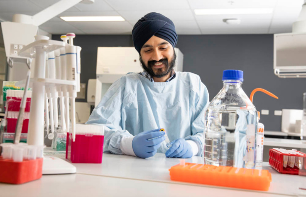 Researcher smiling in lab