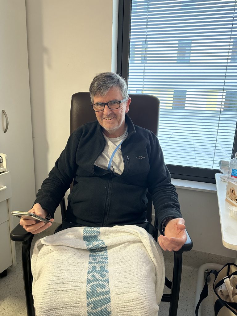 Man sitting in hospital chair 