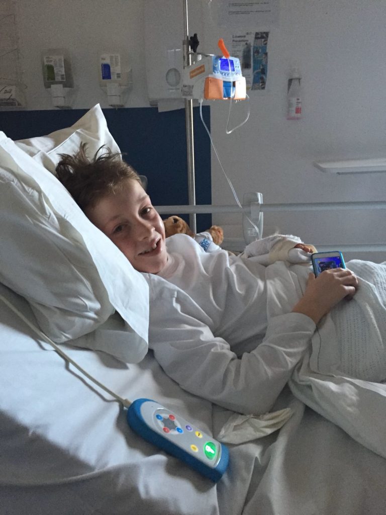 Young boy in a hospital bed after being diagnosed with type 1 diabetes