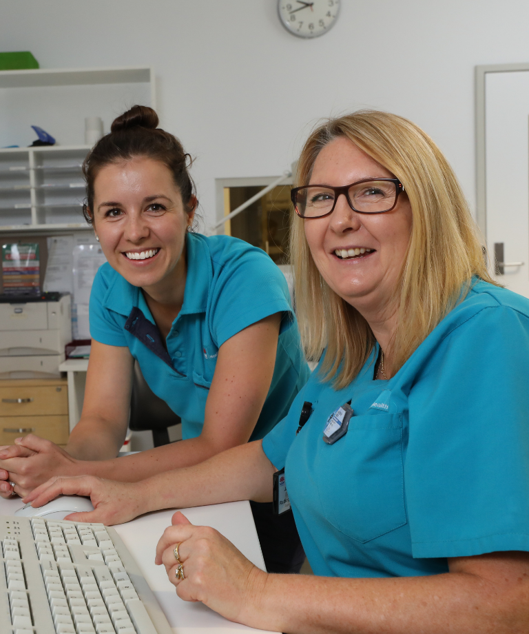 Two female physiotherapists smiling