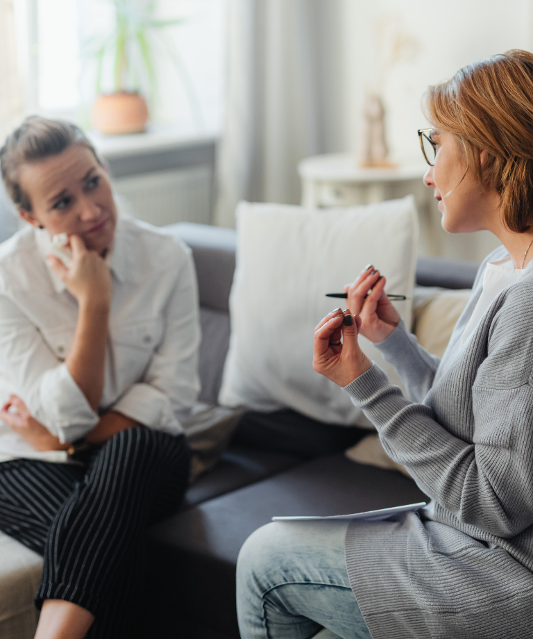 A female therapist chatting to a female patient