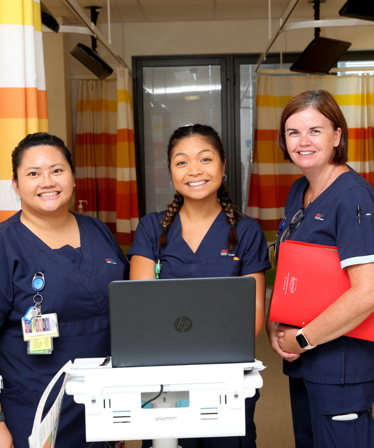 Three female nurses smiling