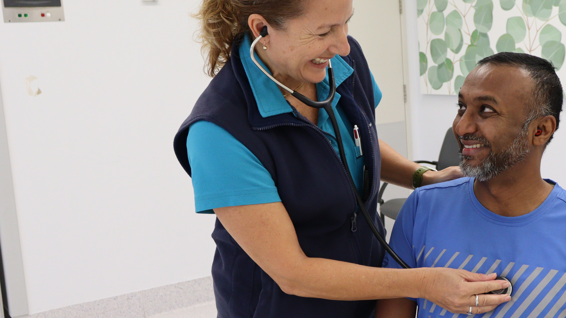 Exercise physiologist with patient