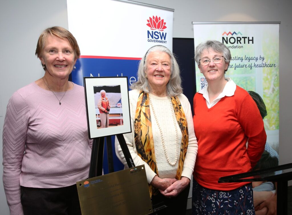 Three females smiling at the Alexis rebot launch