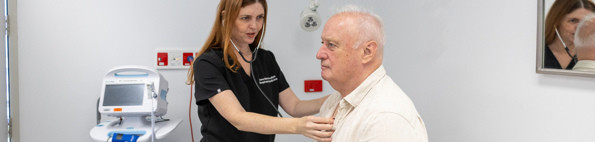 Clinician listening to patient's heart
