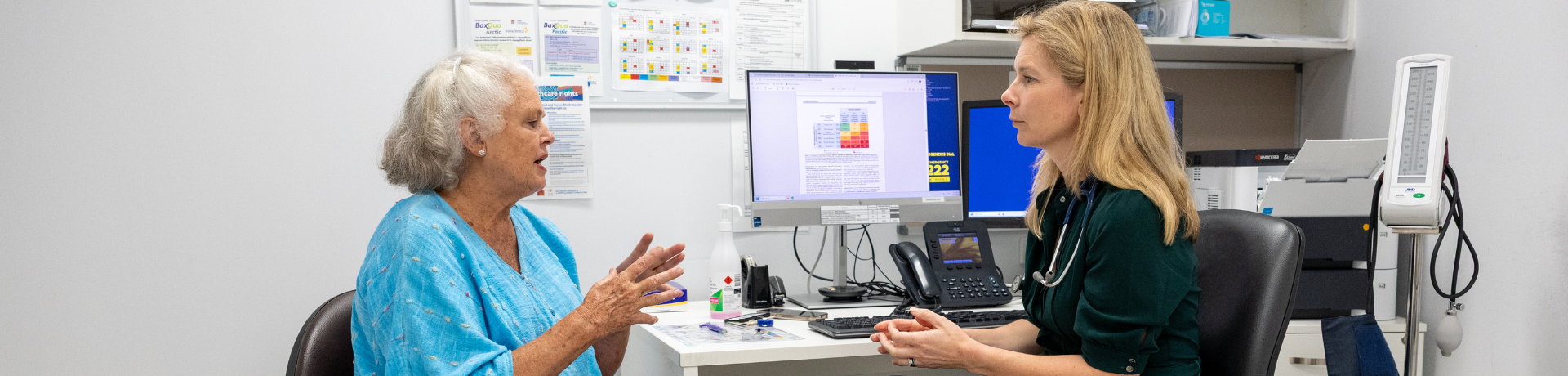 Female doctor with female patient