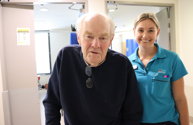Physiotherapist with elderly male patient