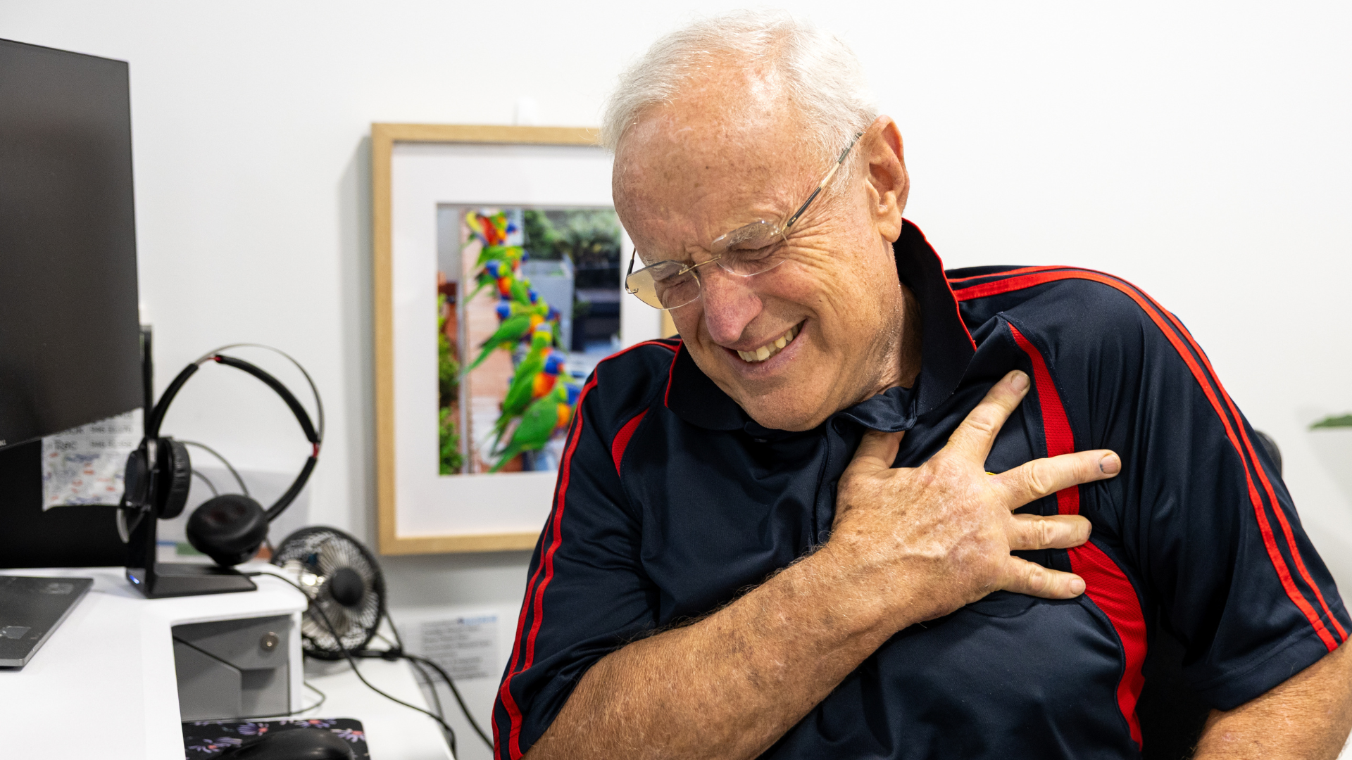 Senior man having a heart attack