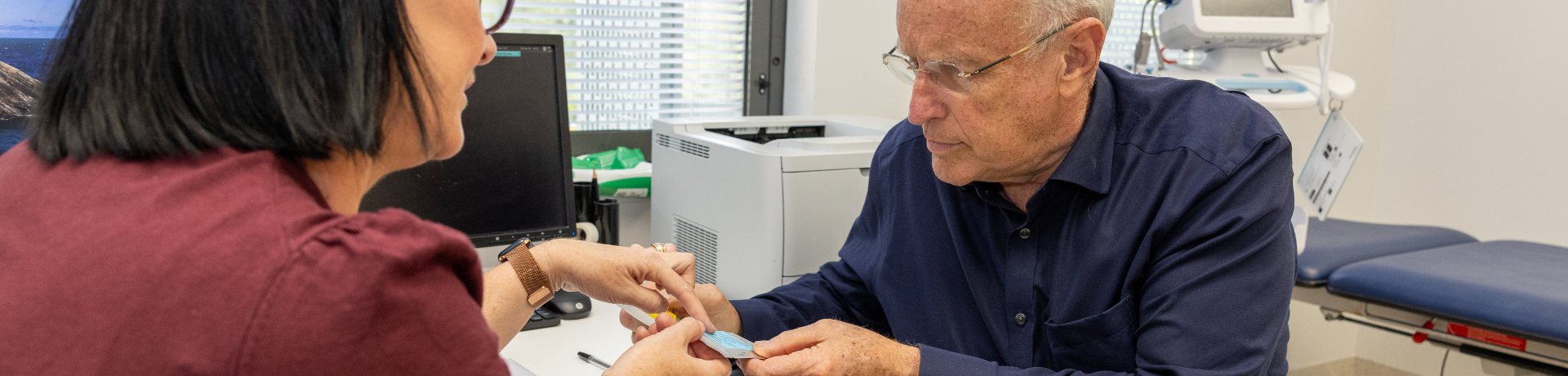 Clinician with patient in hospital