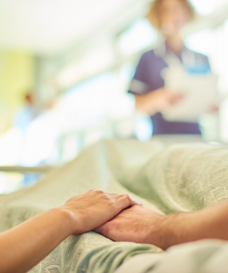 Hand holding in hospital