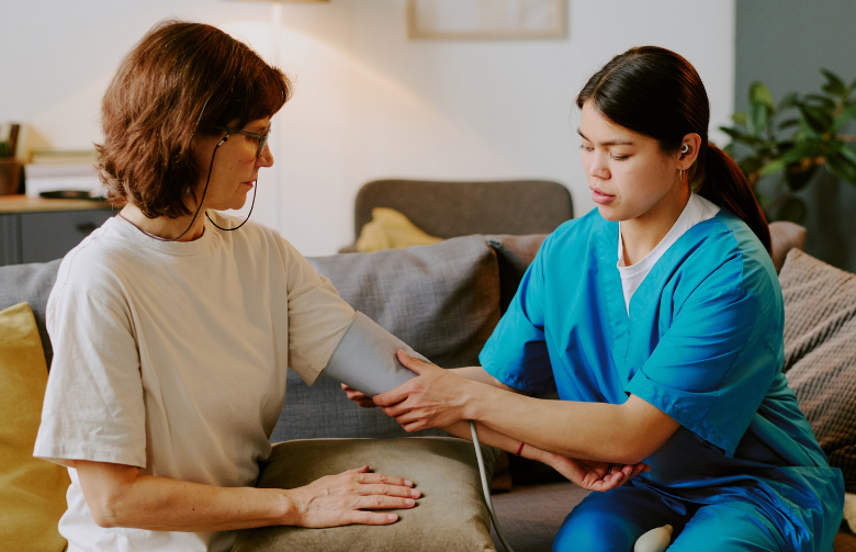Nurse with patient in her home