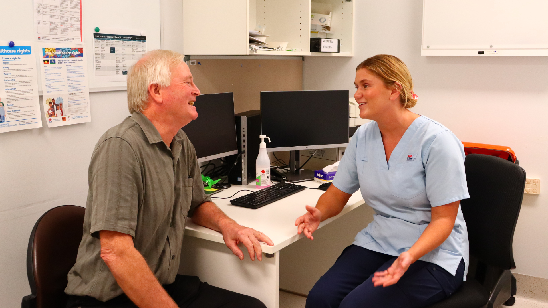 John discussing his treatment with Registered Nurse Emily at NSCC